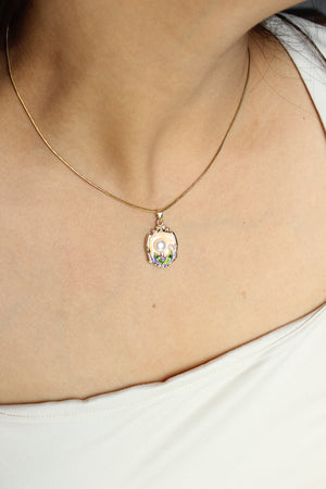 Fairy Crest Pendant Necklace on a model's neck