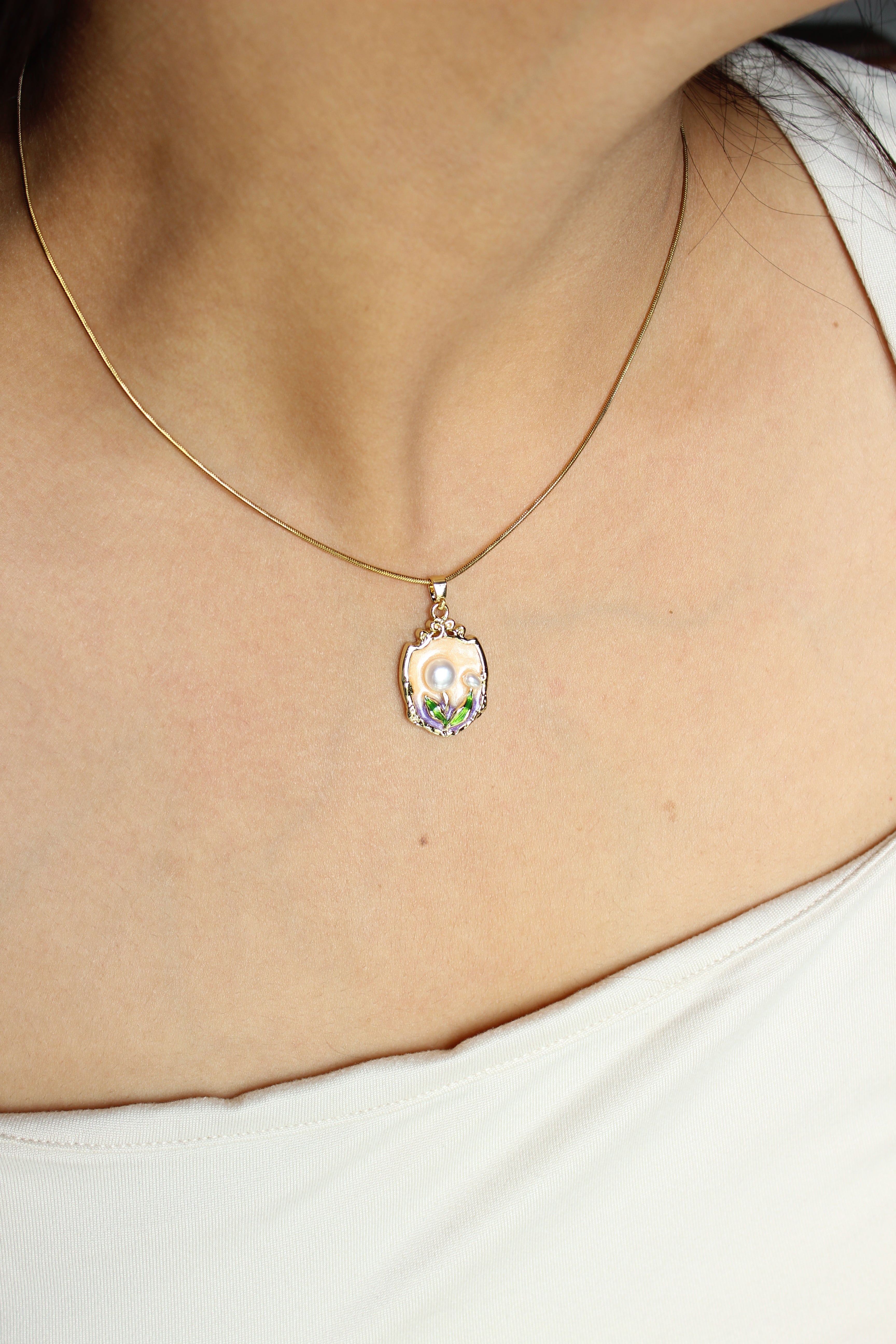 Fairy Crest Pendant Necklace on a model's neck
