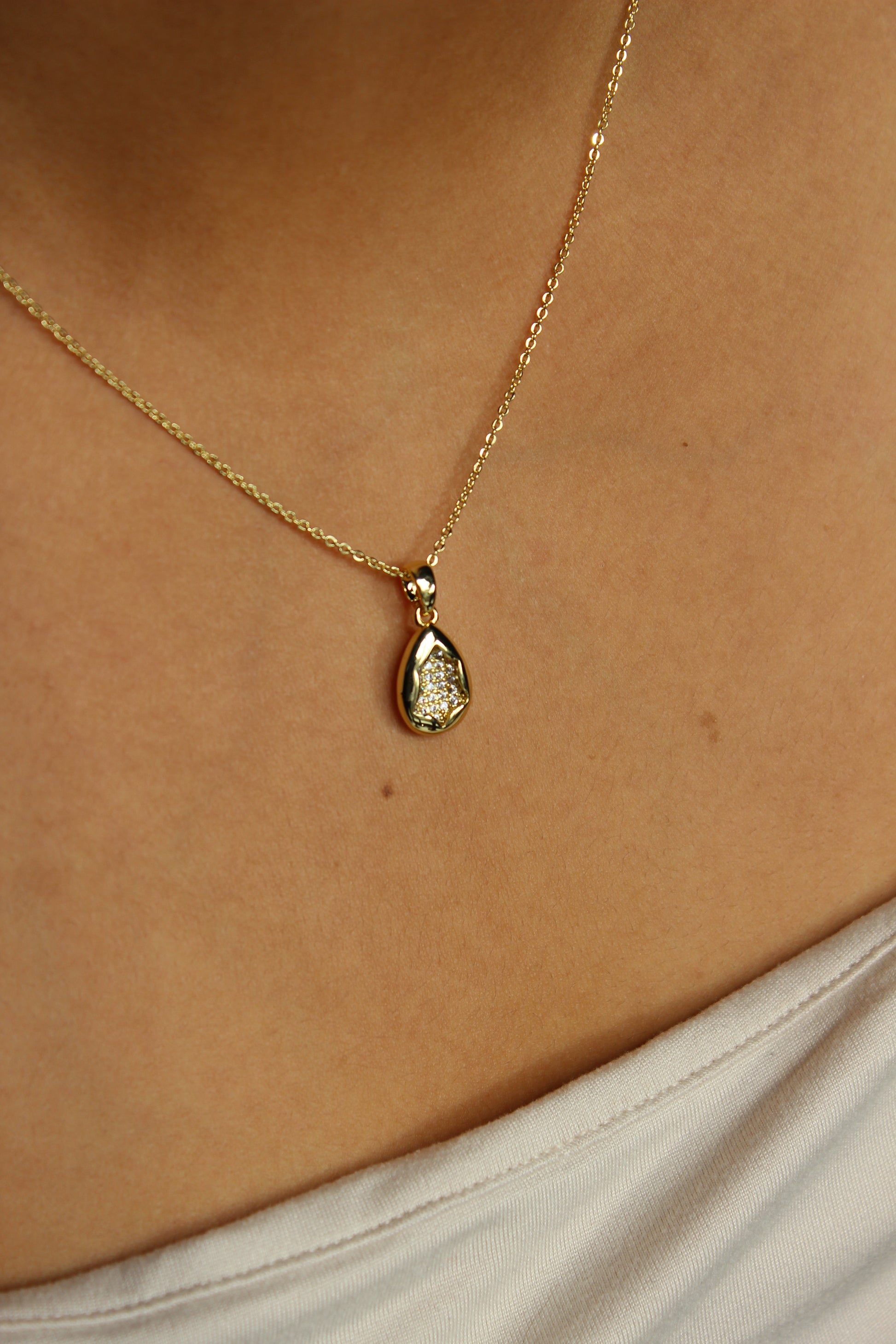 Glow Within Pendant Necklace on a model's neck