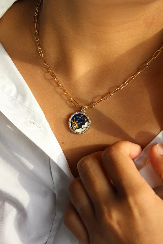 Close-up of a Golden Eclipse Necklace on a model's neck