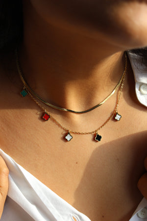 Charm Cascade Necklace on a model's neck