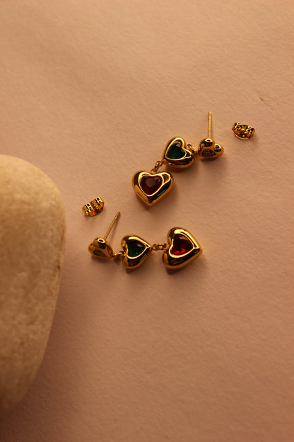 Hearts in Hue Earrings on a light brown surface