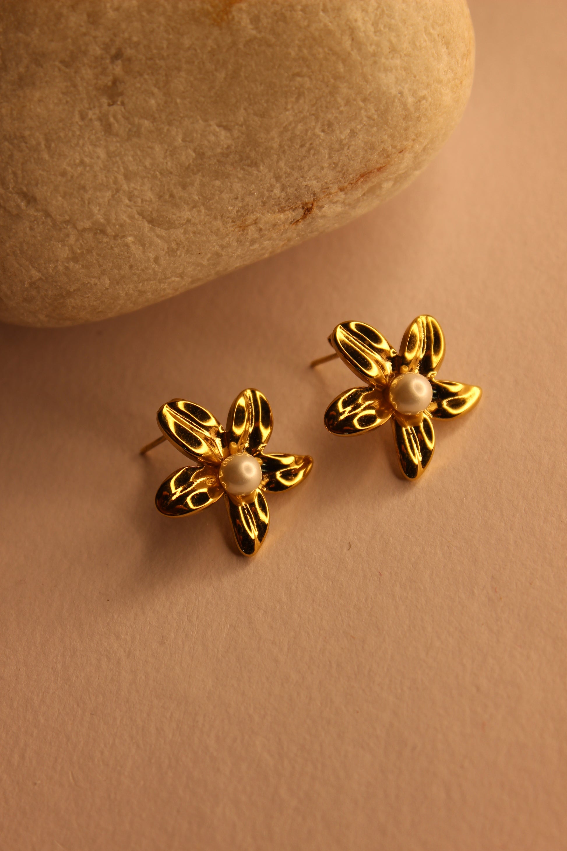 blurred background with pearl centers on a beige background