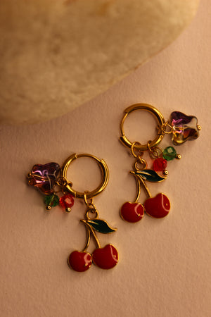 Cherelle Hoop Earrings on a beige background