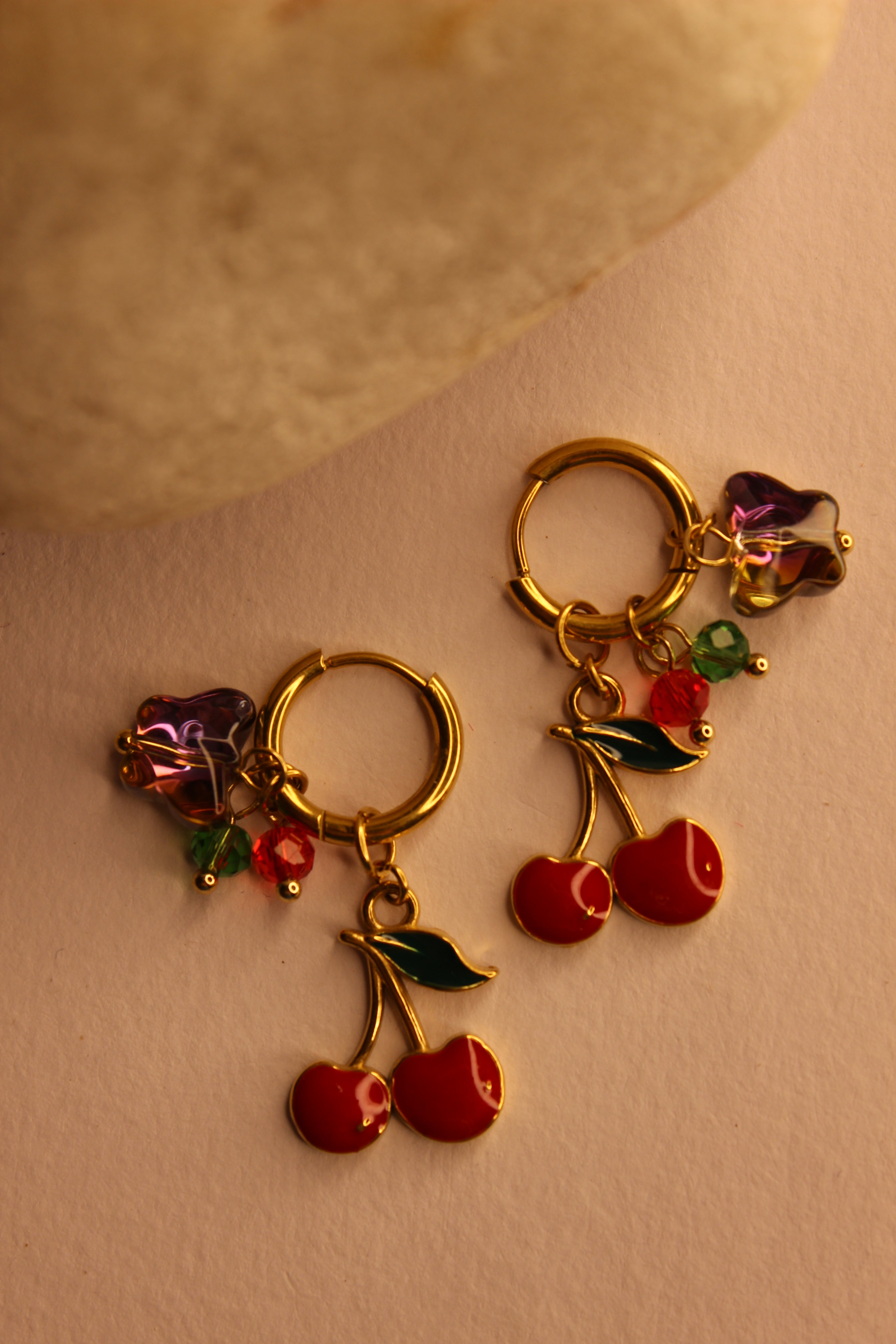 Cherelle Hoop Earrings on a beige background