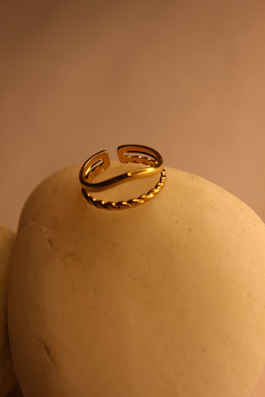 Drift Ring on a beige surface with a warm color tone
