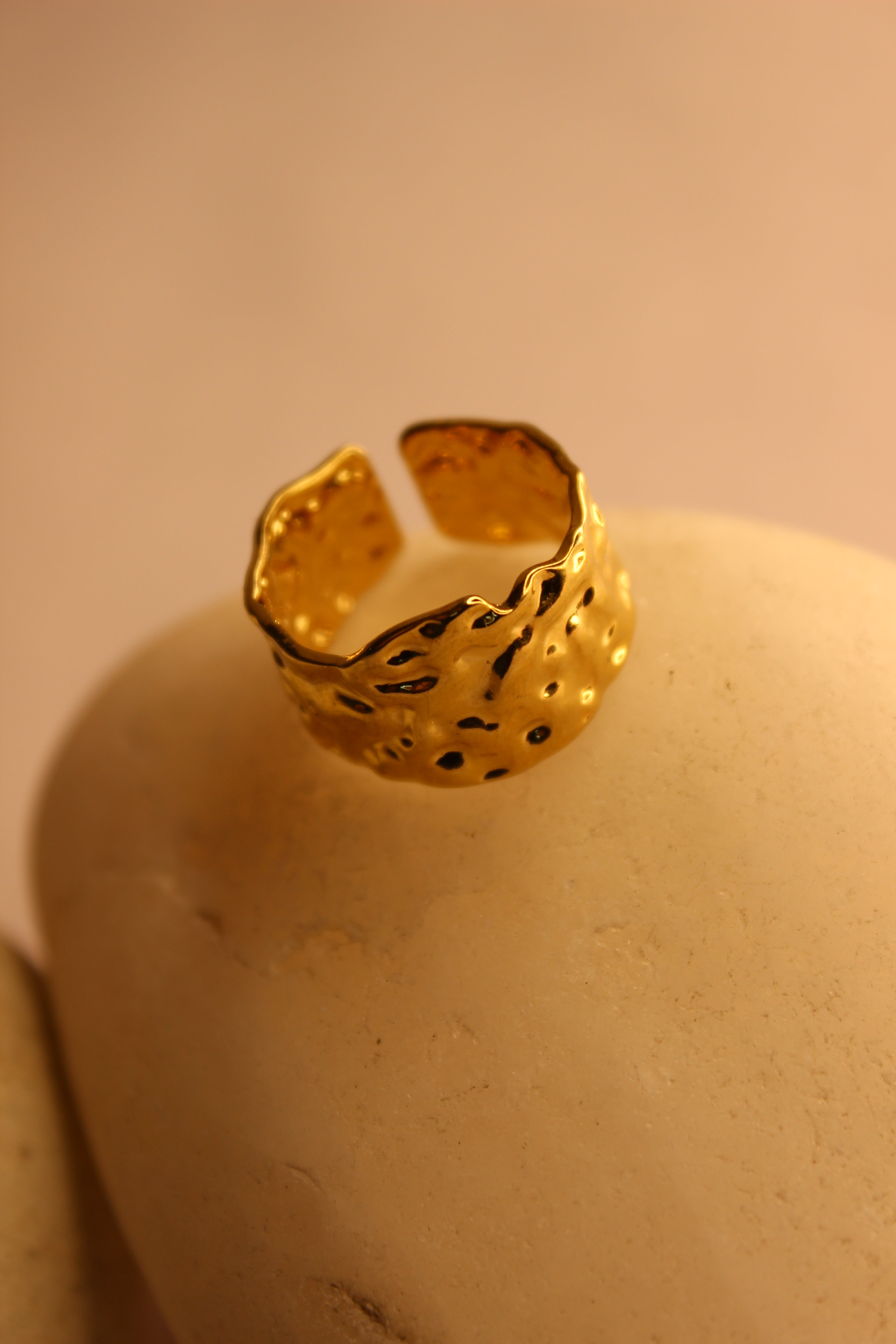 Molte Ring on a beige background