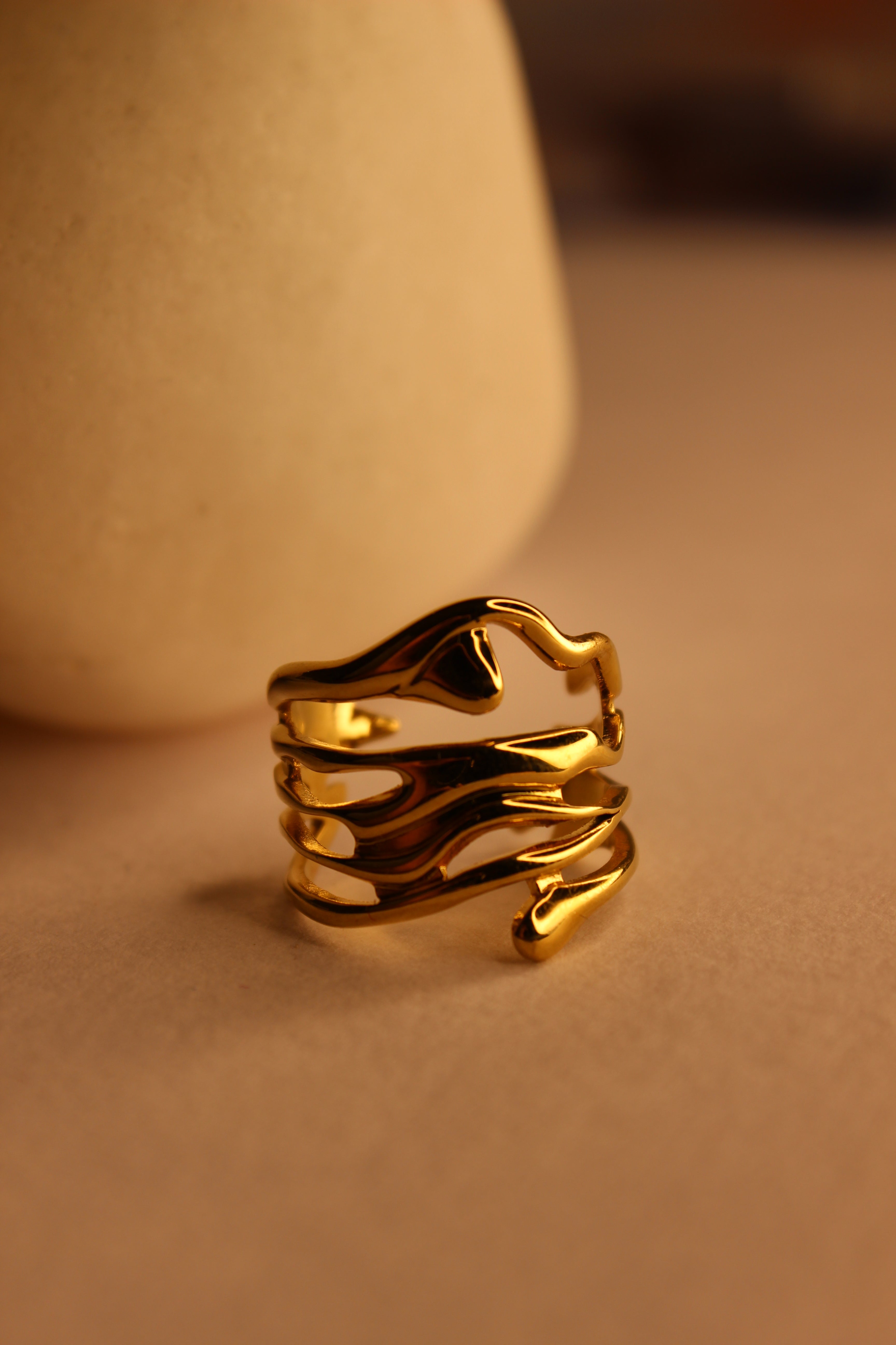 Auriel Ring on a model's finger against a neutral background