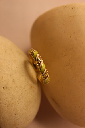 SolPop Ring on a beige stone surface