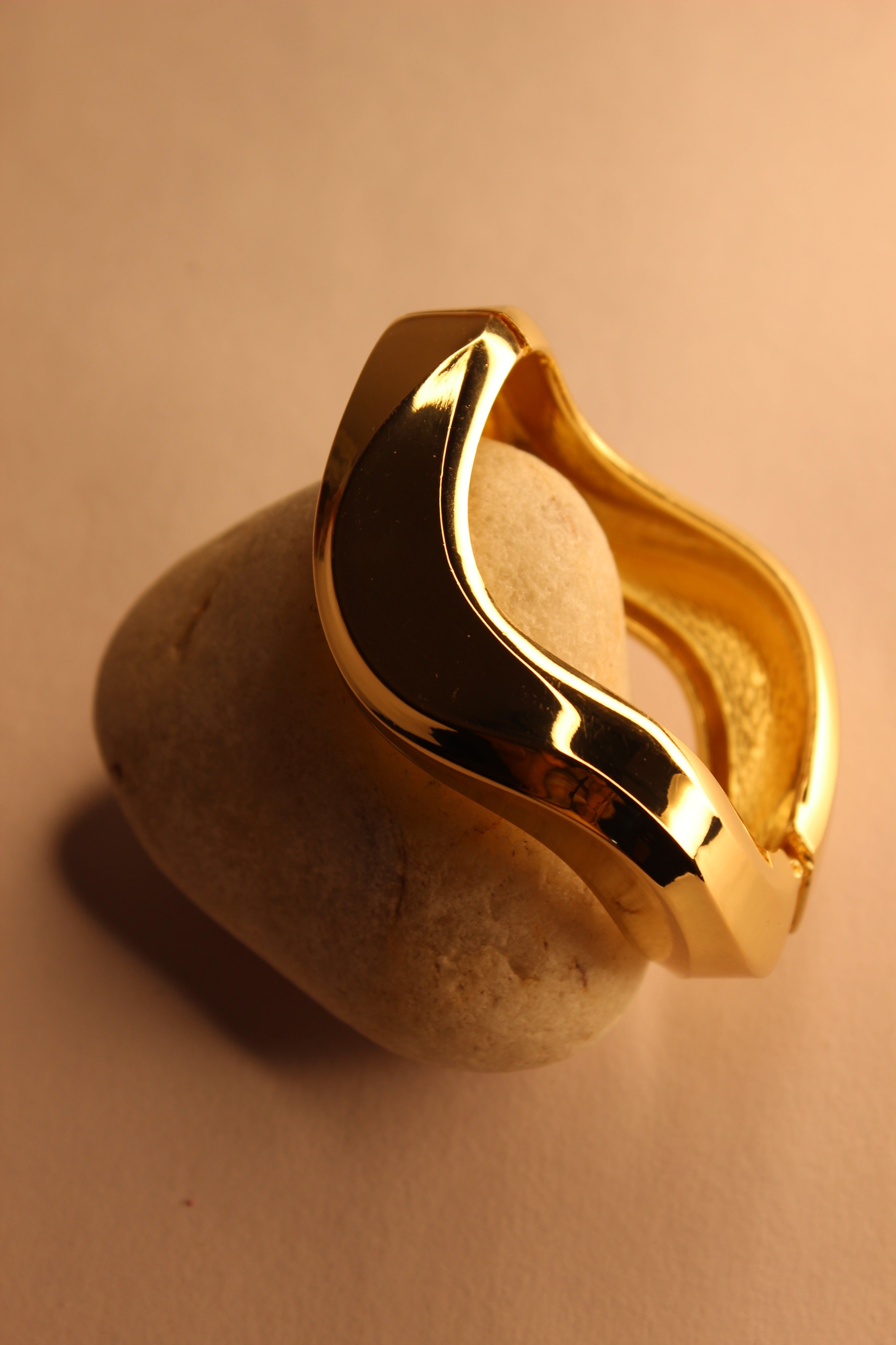 Vetra Bracelet on a stone with a warm beige background