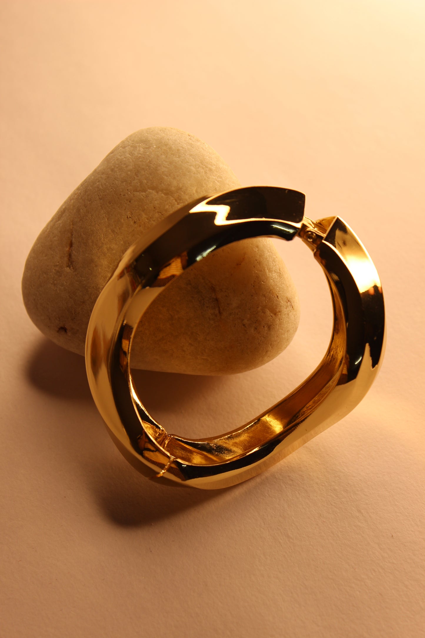 Vetra Bracelet on a stone surface with a warm beige background