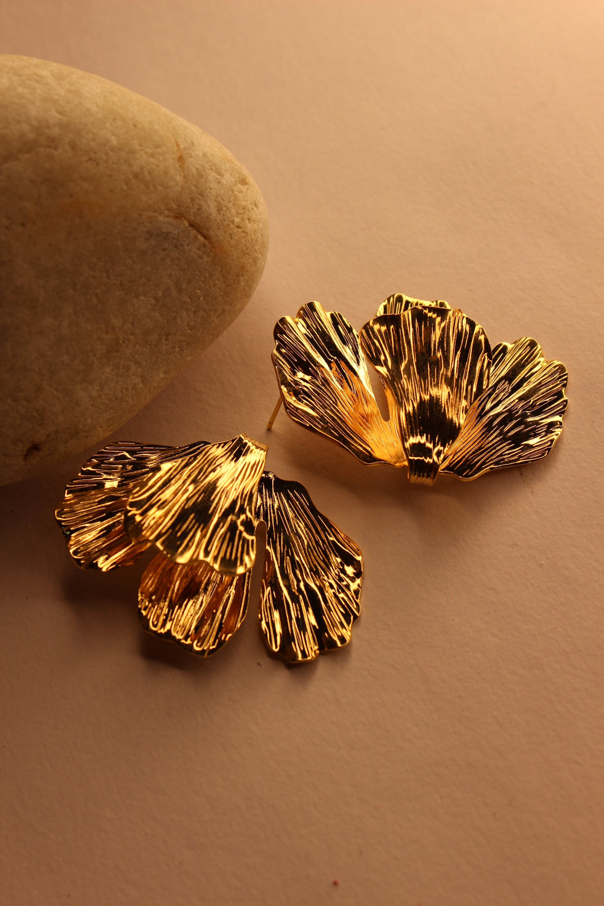 Ethereal Fleur Earrings on a brown background