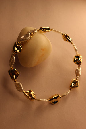 Baroqa Necklace on a beige background