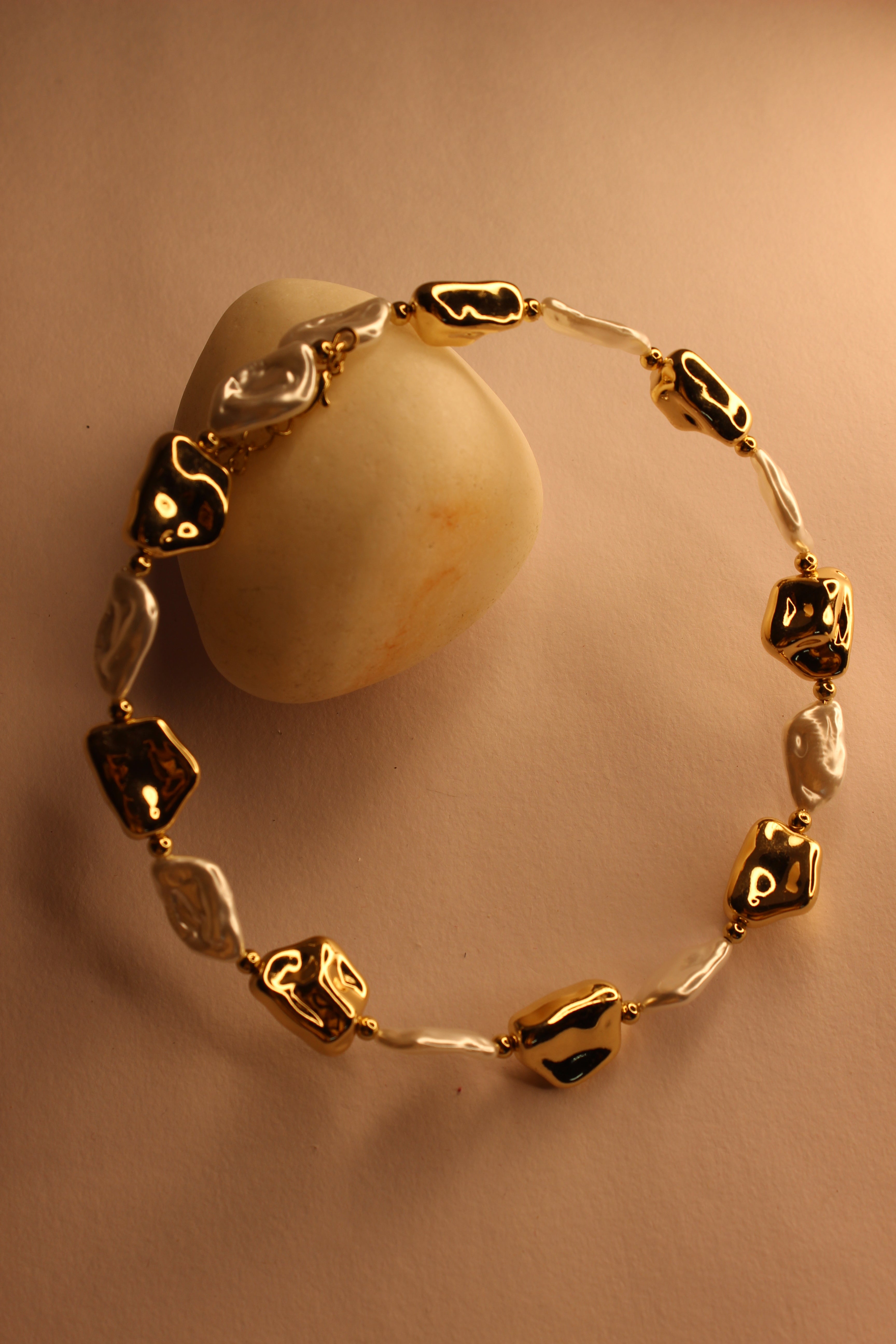 Baroqa Necklace on a beige background