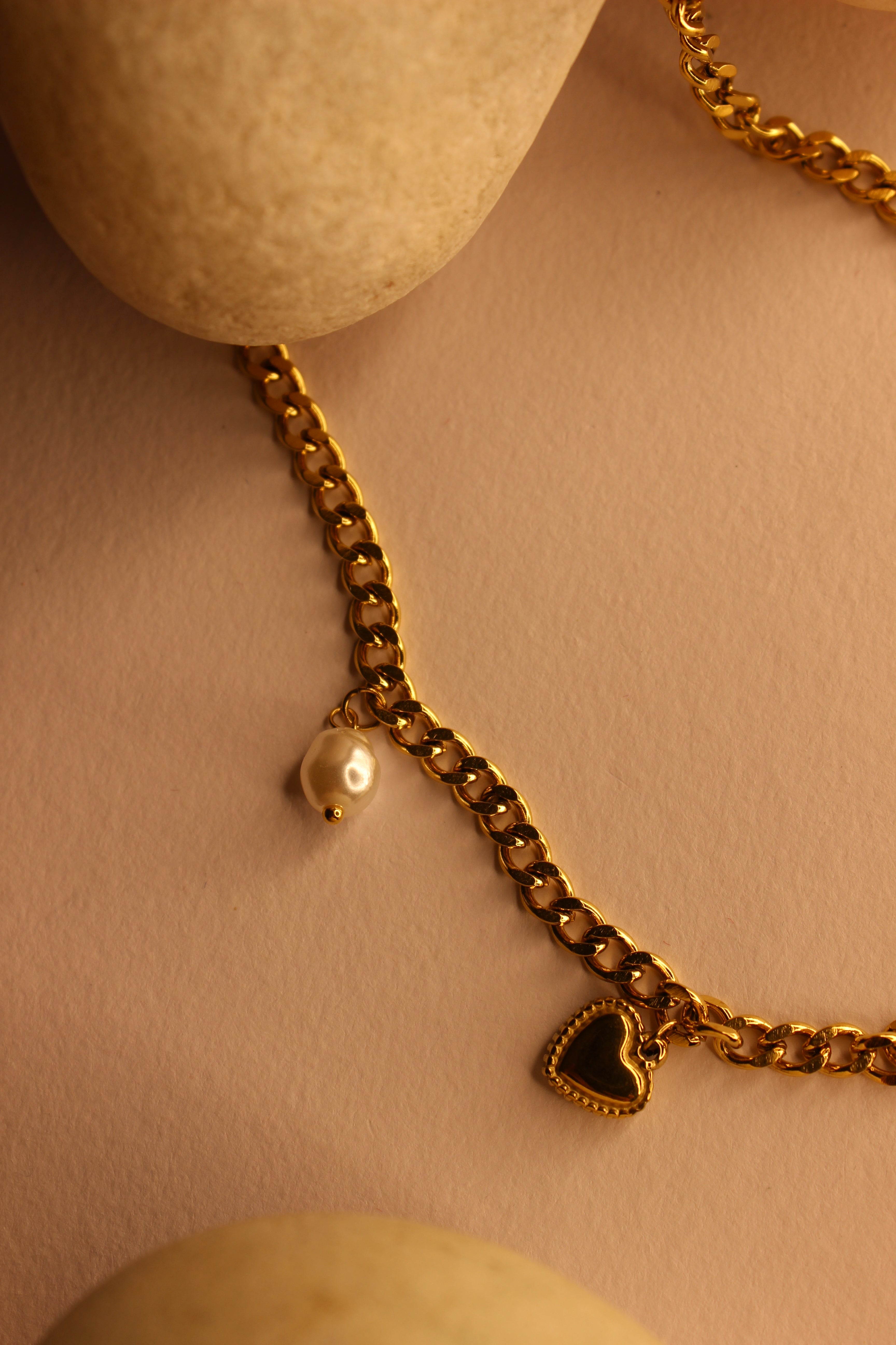 WishBlush Charms Necklace on decorative stones with bright yellow background, trendy jewelry for women