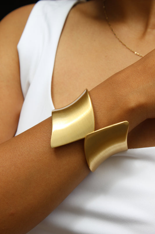 Arcus Bracelet on a model wearing a white top against a neutral background