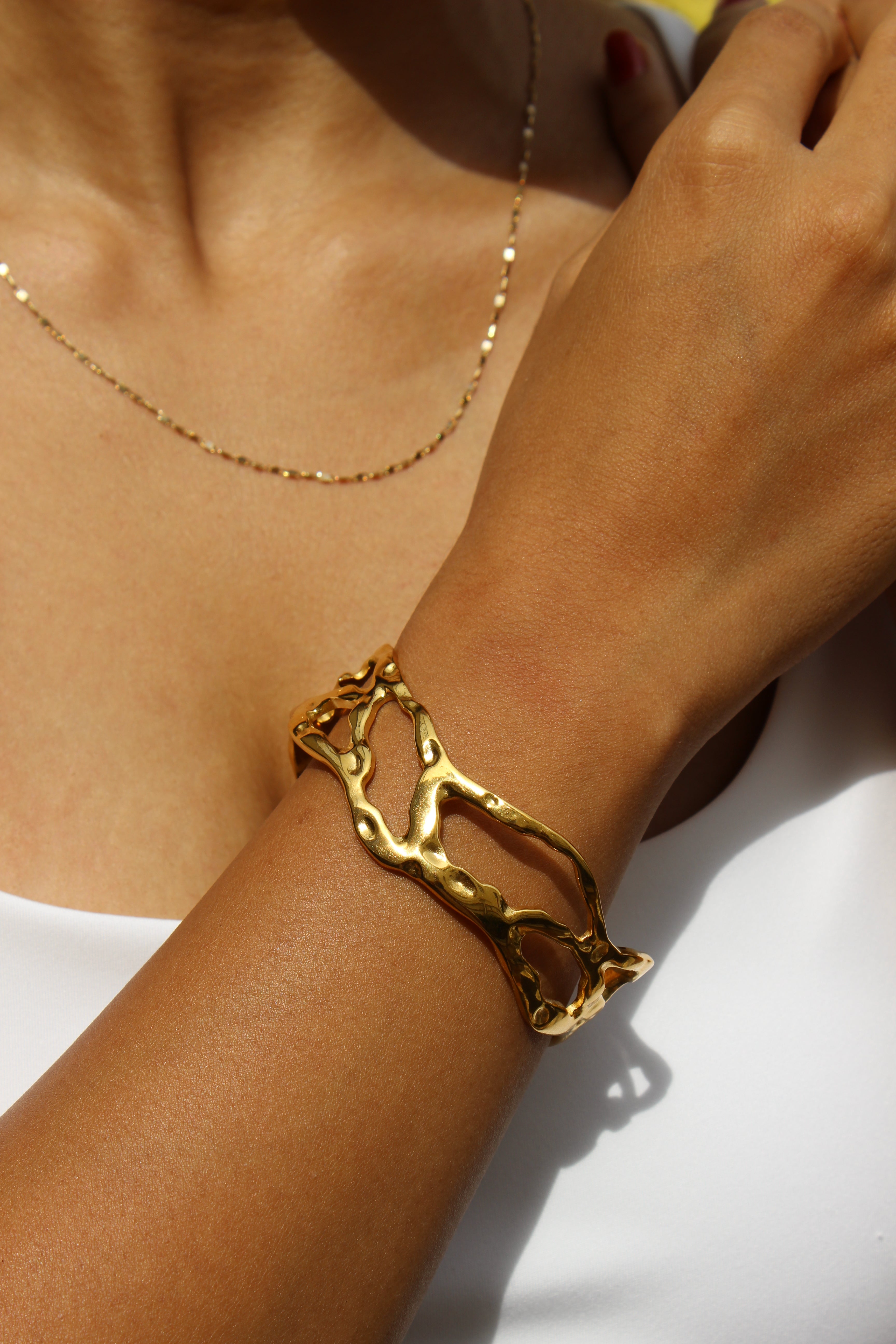 Orra Cuff Bracelet on a wrist with a neutral background