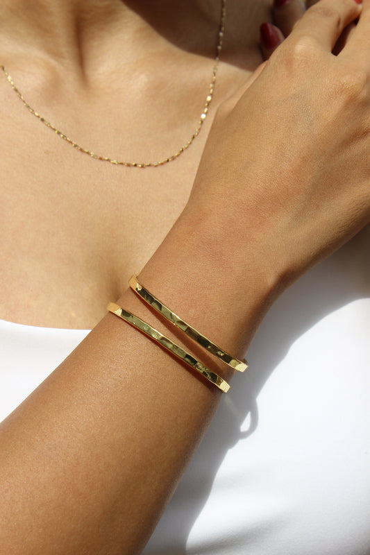 Elaris Cuff Bracelet on a wrist with a neutral background