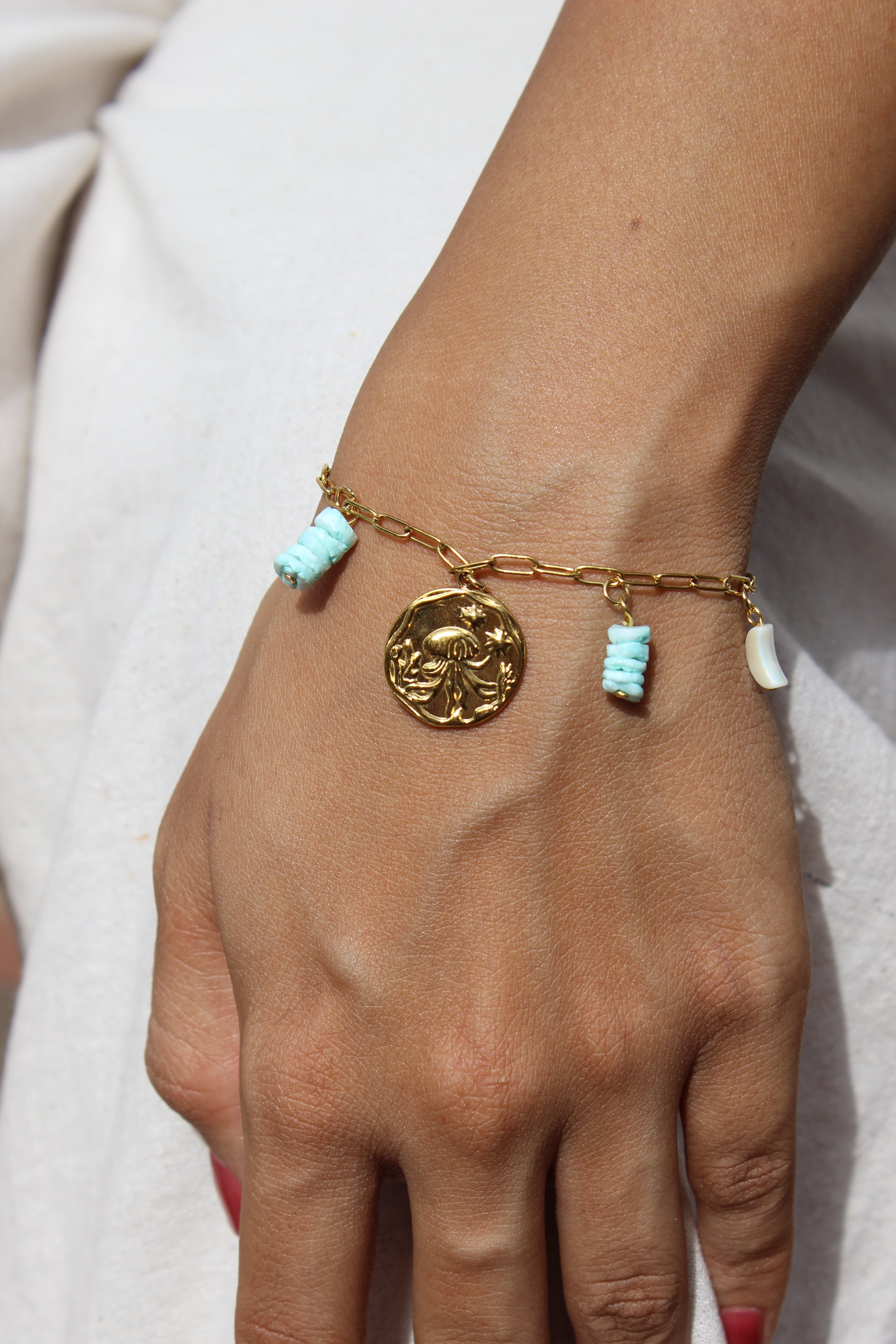 Deep Relic Charms Bracelet on a plain background