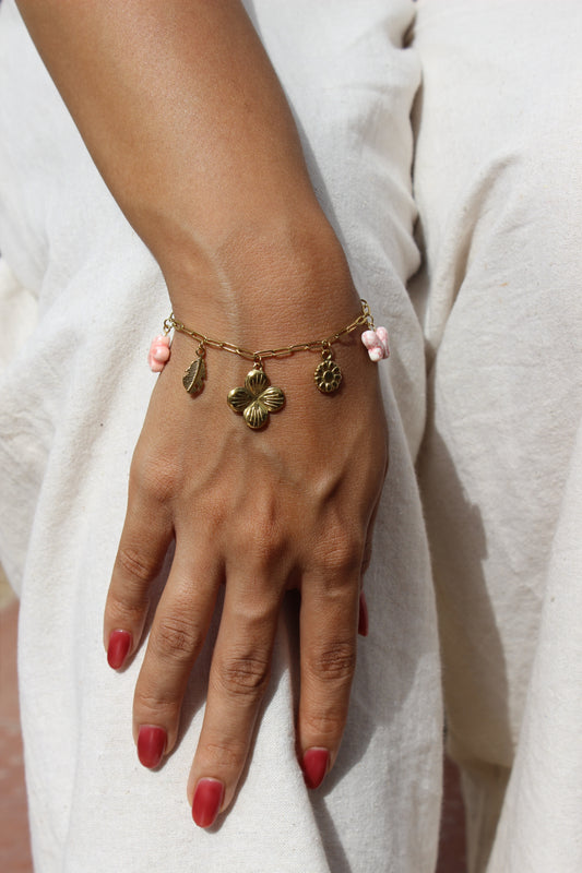 Flutter Bloom Charms Bracelet on a light background