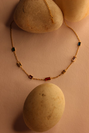 Oriel Necklace on a beige surface