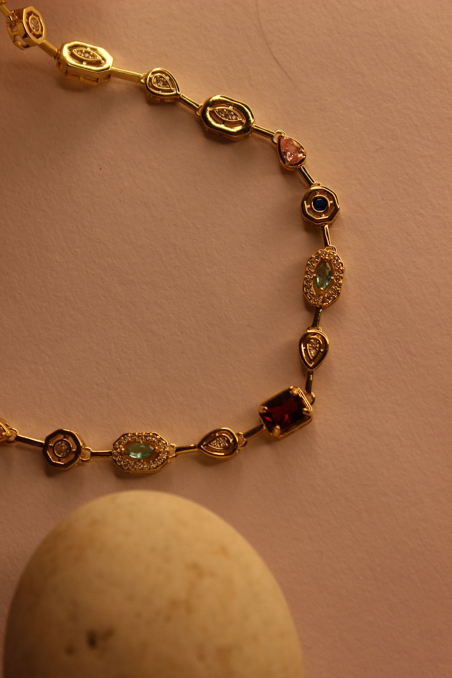 Solstice Waltz Necklace on a yellow background