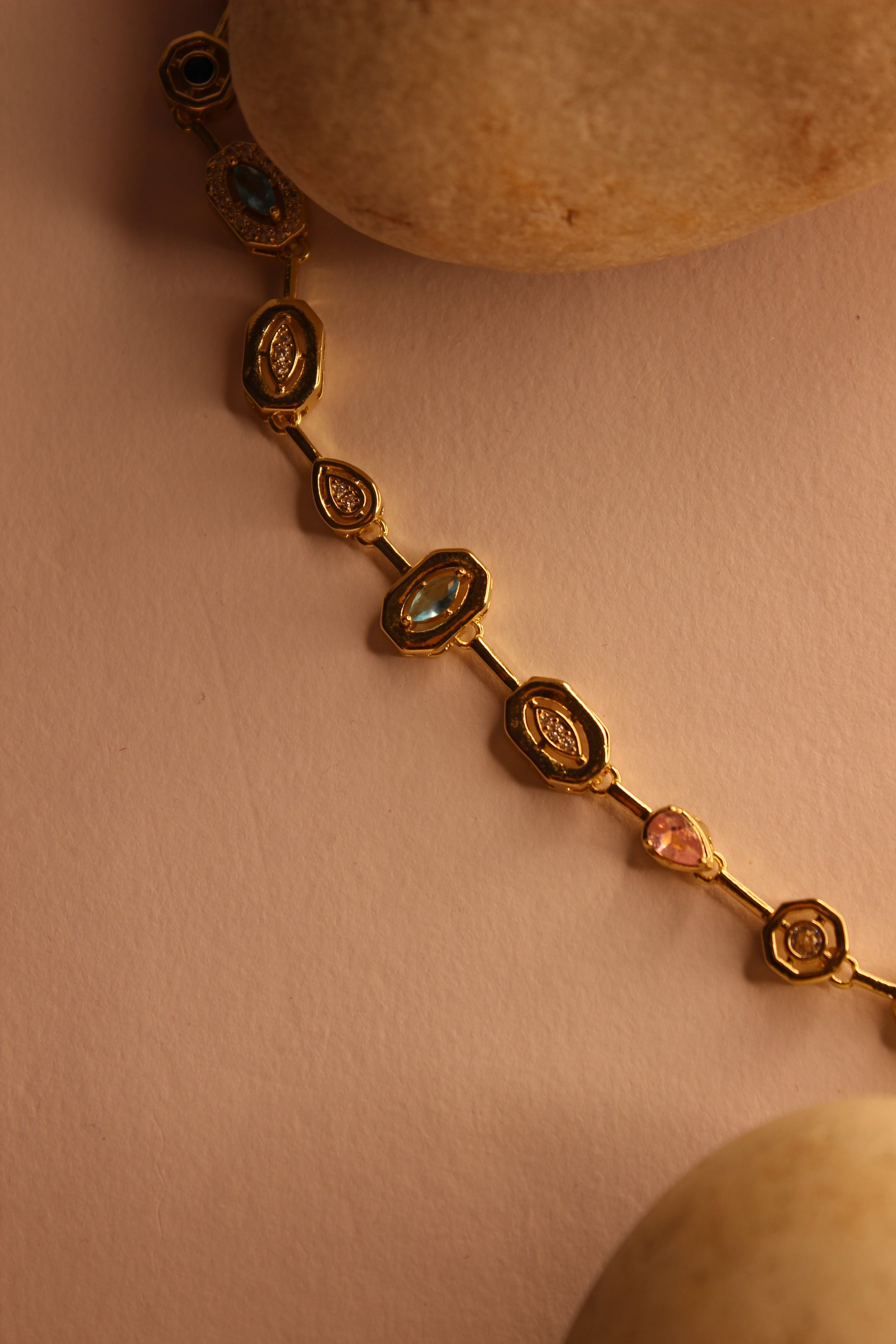 Solstice Waltz Necklace on a soft pink background