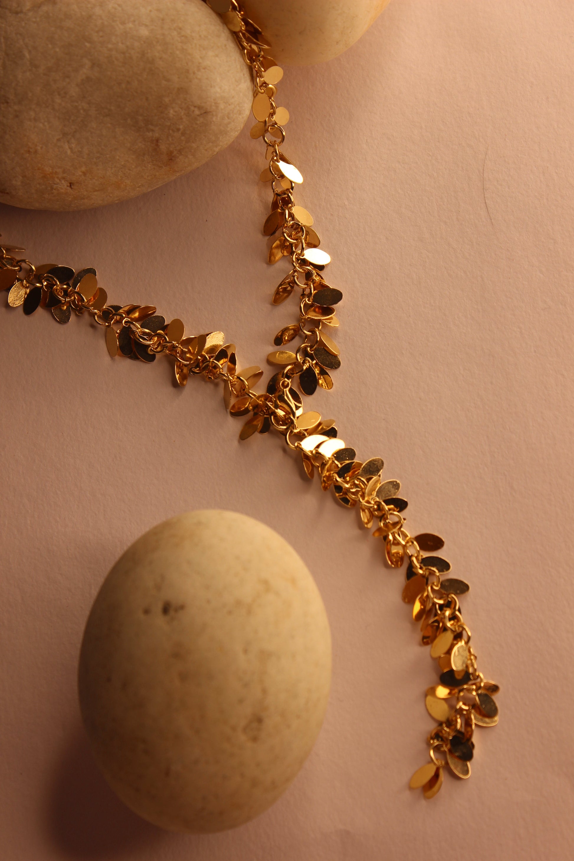 Nightsway Necklace on a pink surface with stones