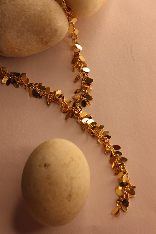 Nightsway Necklace on a pink surface with stones