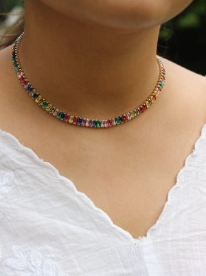 Multicolored beaded Jeweltone Parade Necklace on a model wearing a white top