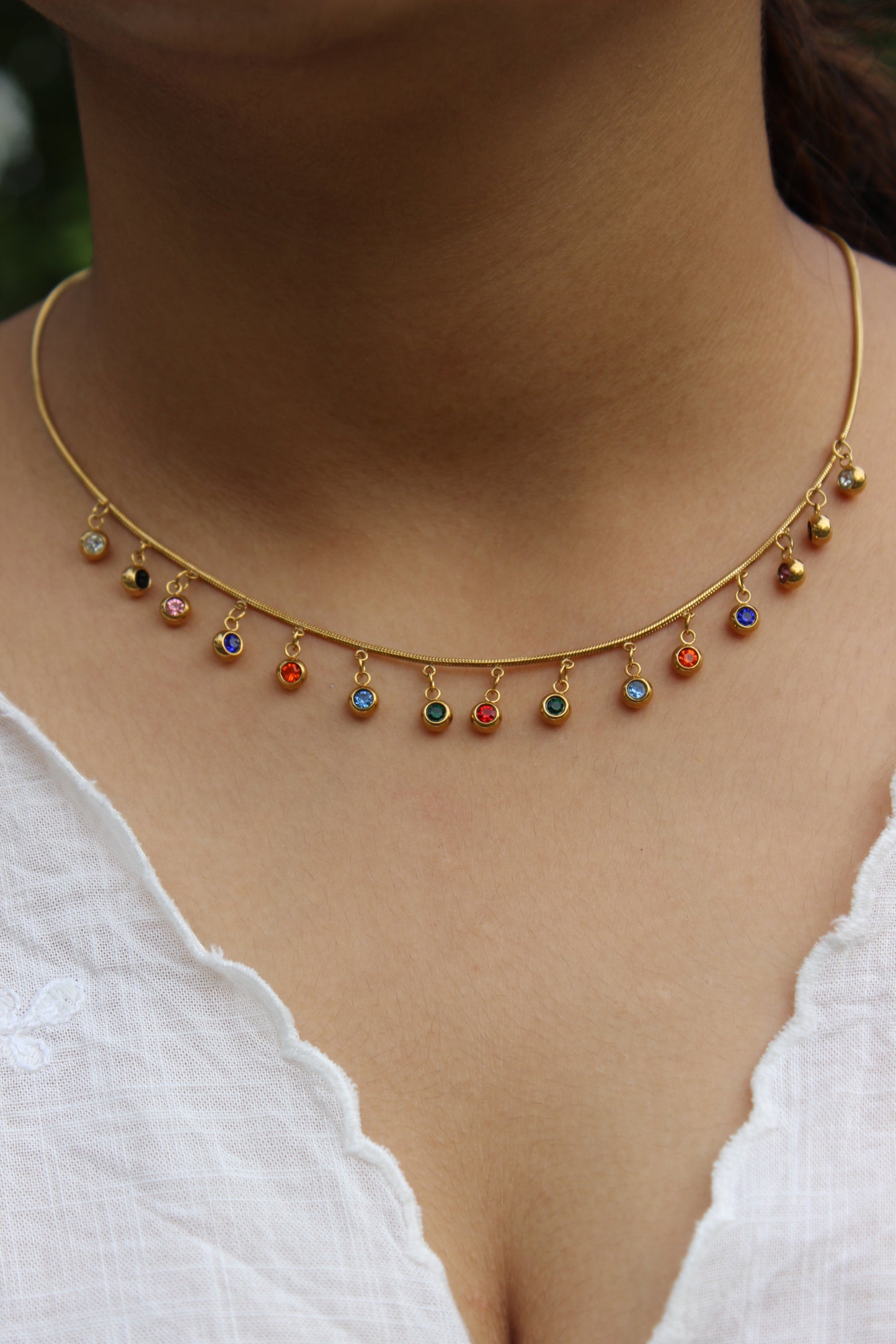 Chroma Dots Necklace on a model's neck against a white background