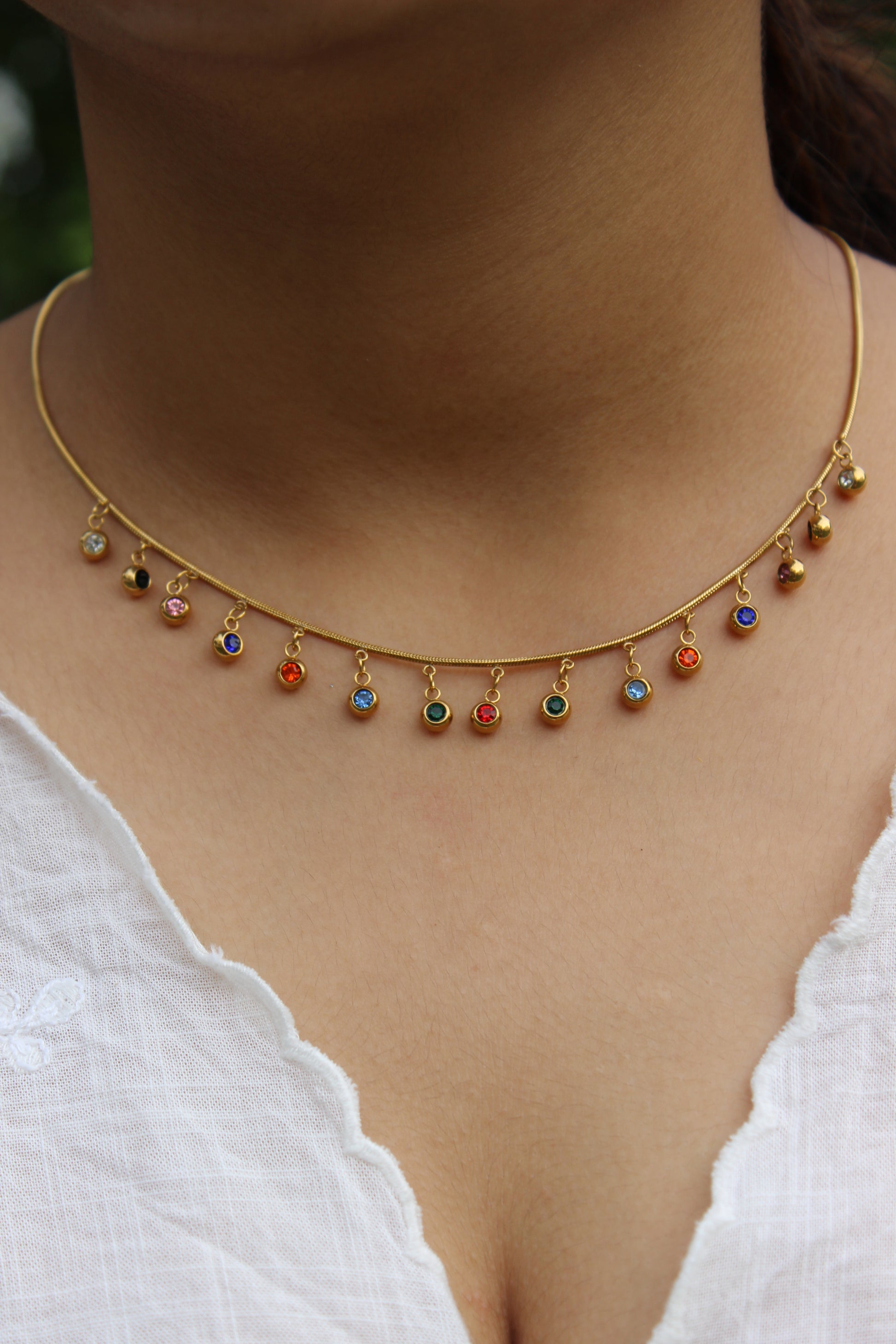 Chroma Dots Necklace on a model's neck against a white background