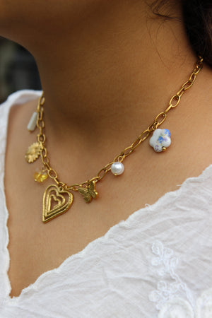 Hearts in Bloom Charms Necklace on a model's neck