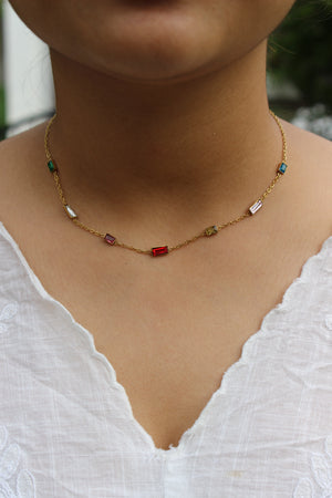 Oriel Necklace on a model's neck against a white fabric background
