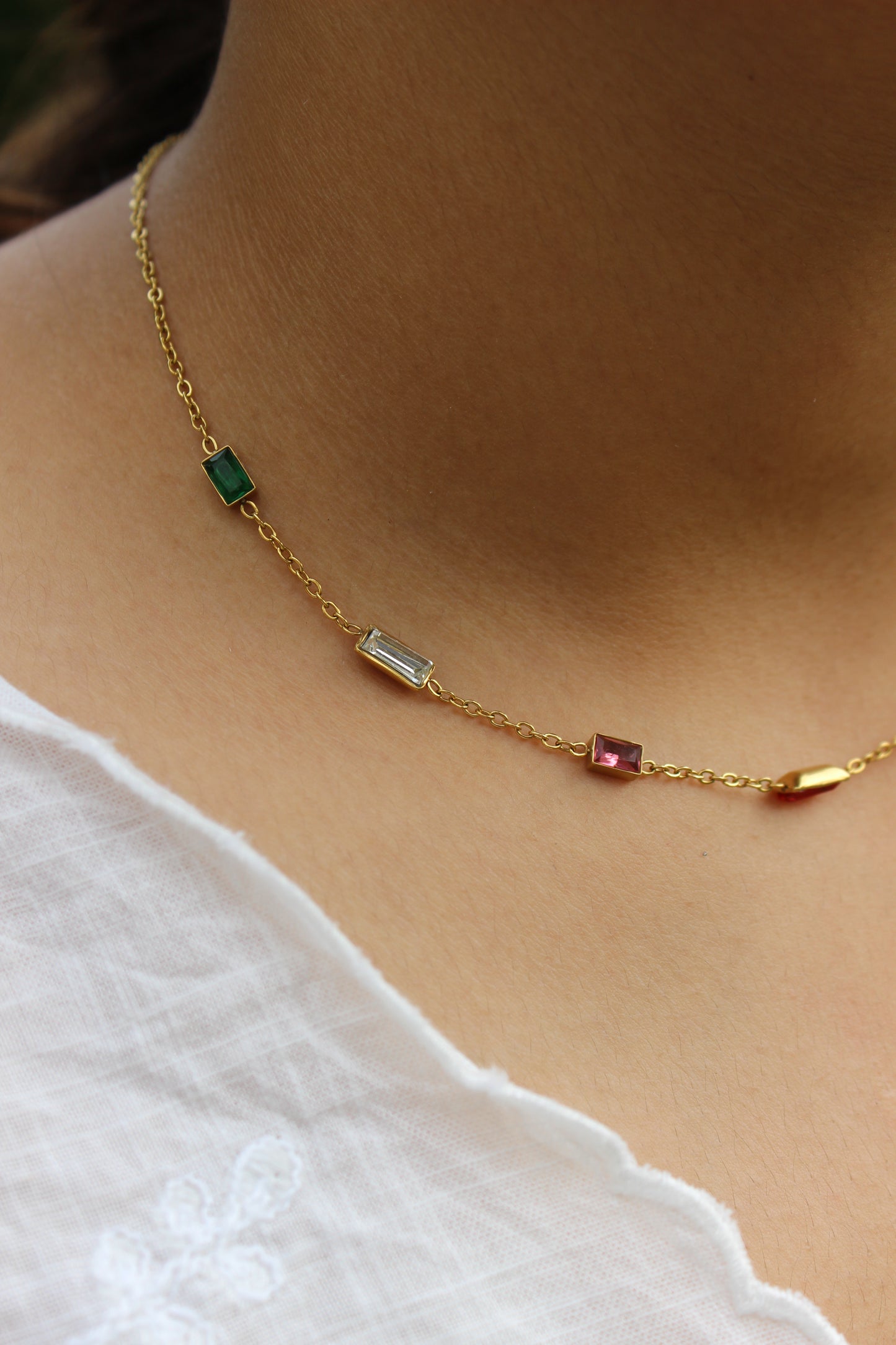 Oriel Necklace on a model wearing a white top
