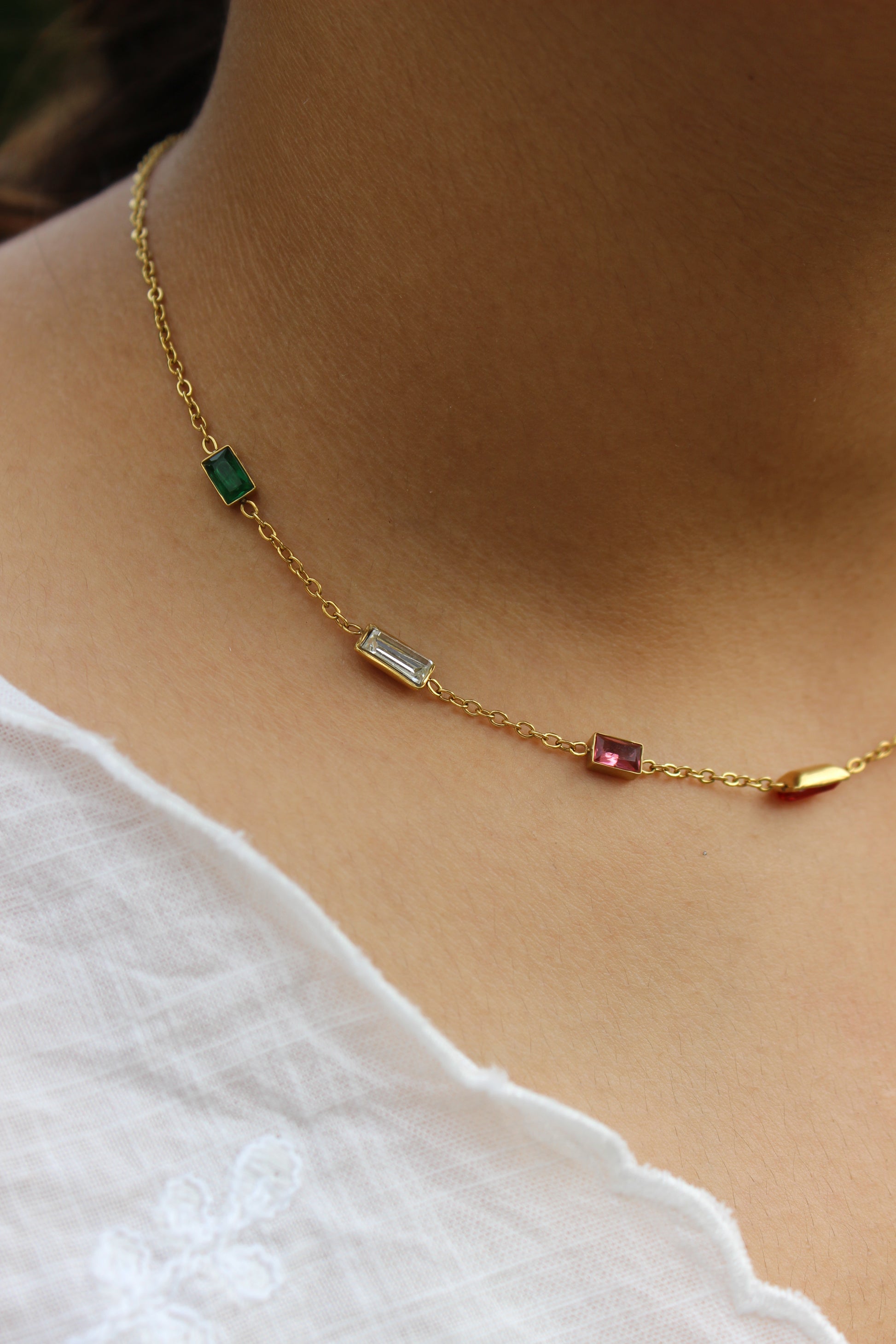 Oriel Necklace on a model wearing a white top