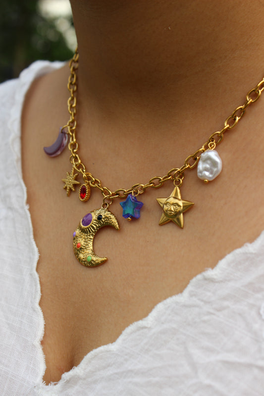 Lunar Spells Charms Necklace on a model's neck against a white background