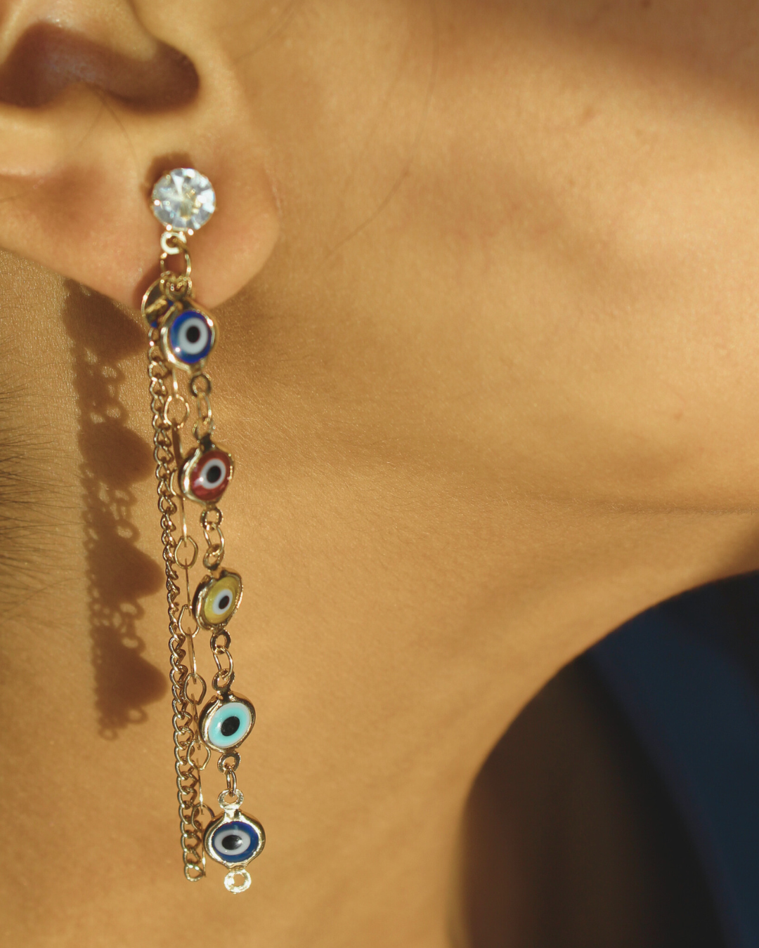 Kaleidogaze Long Dangle Earrings on a beige background