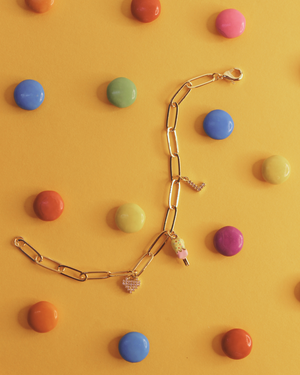 Sugar Links Charm Bracelet on a yellow background 