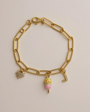 Sugar Links Charm Bracelet on a light pink background