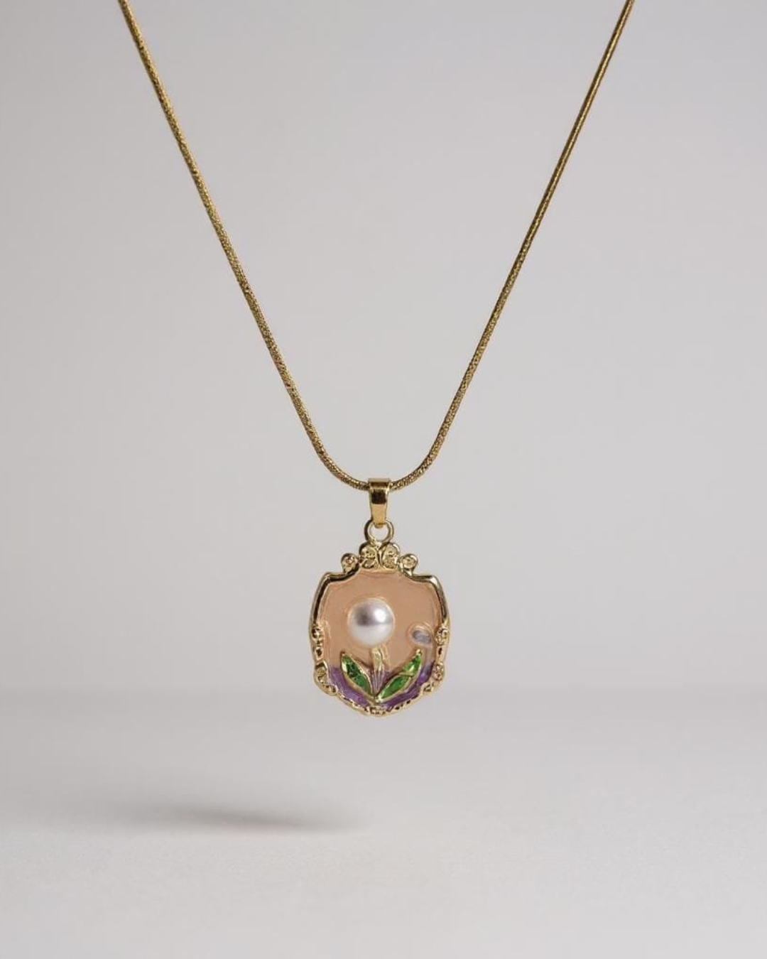 Fairy Crest Pendant Necklace on a light gray background