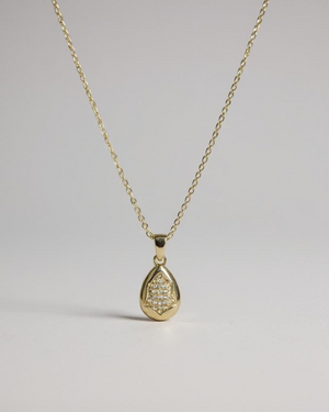 Glow Within Pendant Necklace on a light gray background