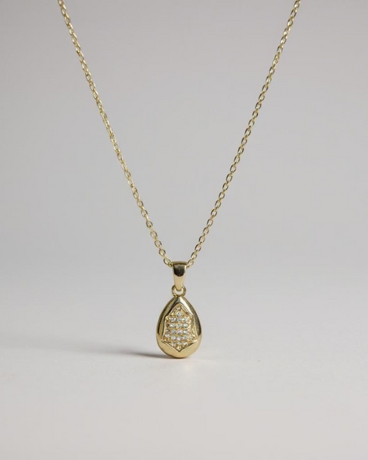 Glow Within Pendant Necklace on a light gray background