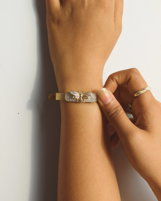 SolBee Watch Bracelet being worn on a wrist with a plain background